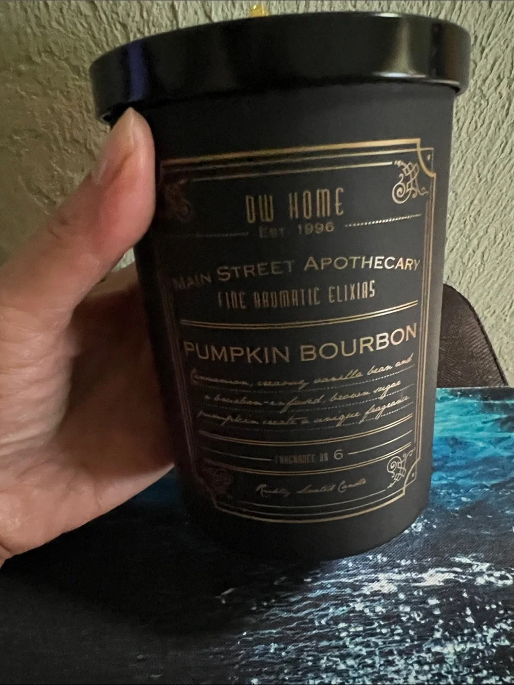 #3,007**DW Home Pumpkin Bourbon Candle Jar in Black and Gold